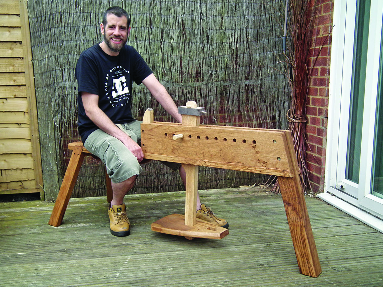 Lee Stoffer poses on his completed shave horse.