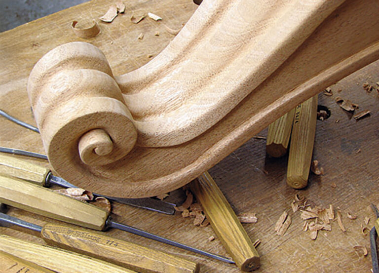 Wood carving tools and sculpted scroll workbench
