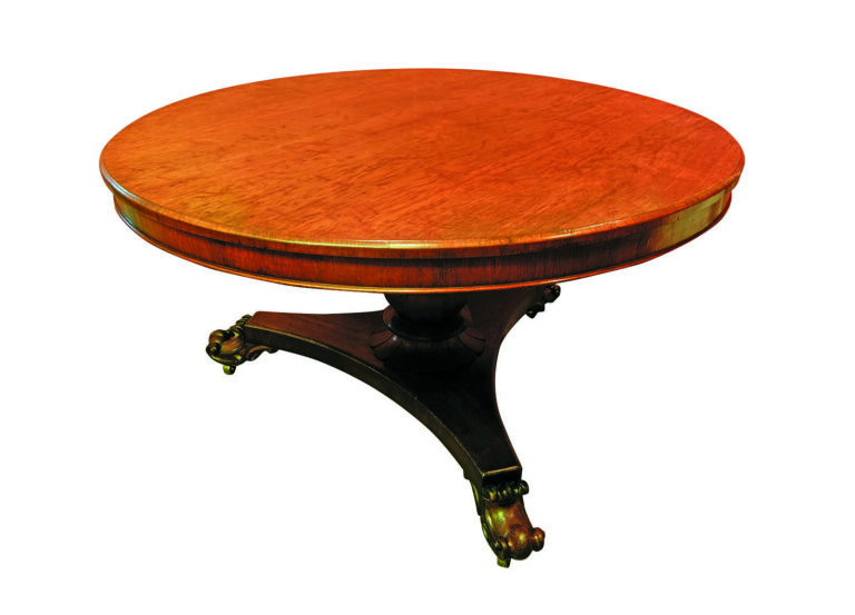 Round wooden table with ornate legs