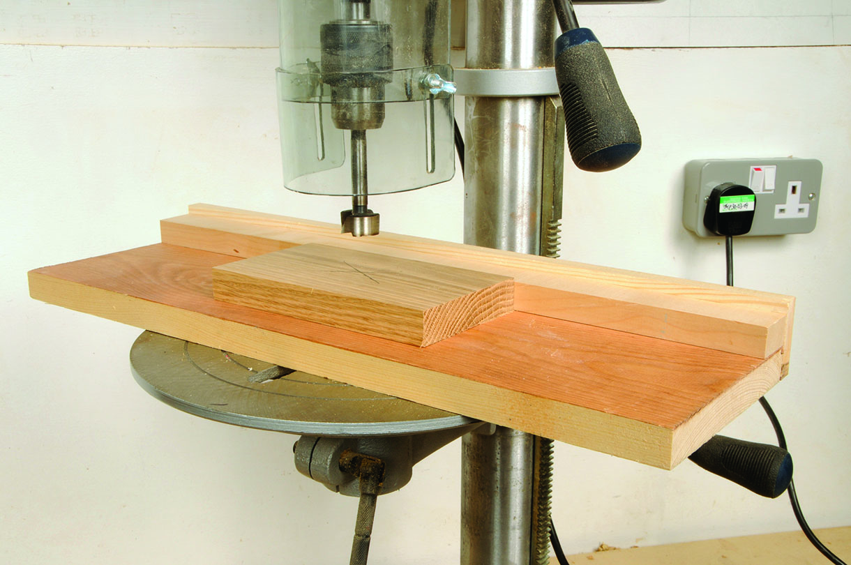 A long piece of wood on a plunge drill