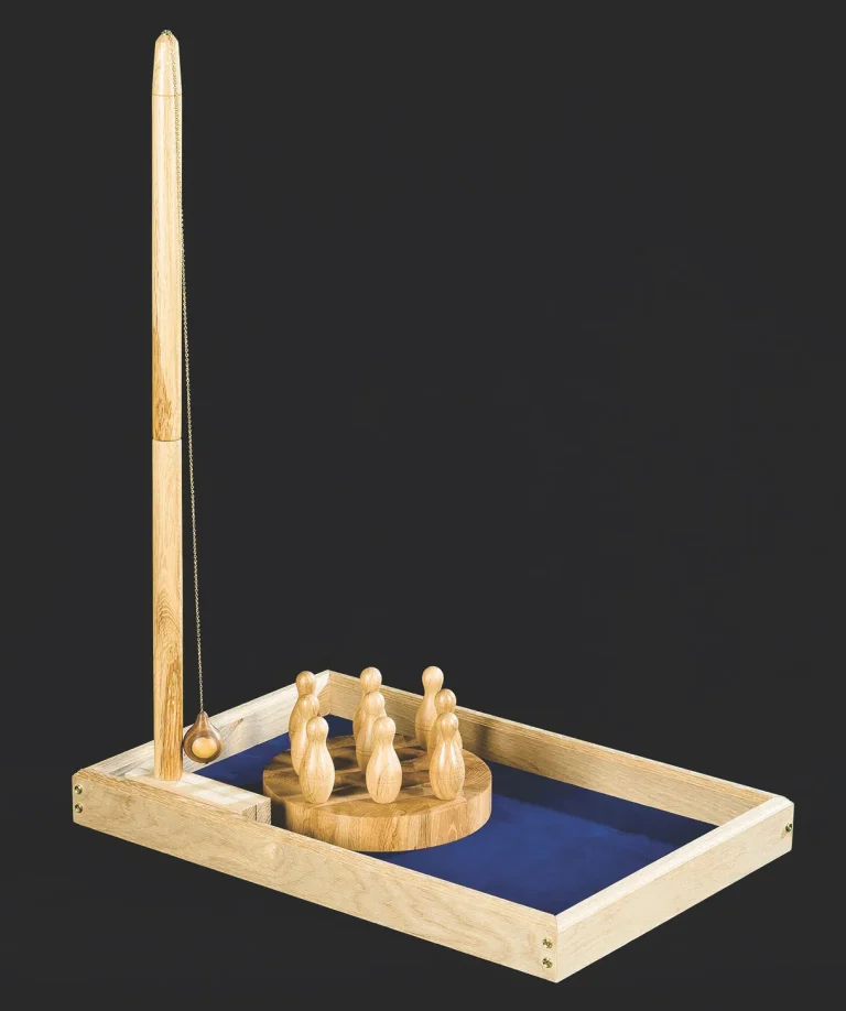 Wooden tabletop ring toss game with pins and string.