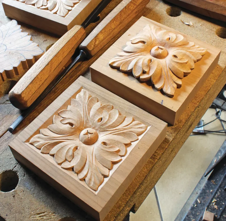 Wood carving with intricate floral patterns and tools.