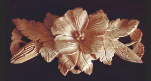 Close-up of intricately carved wooden flower.
