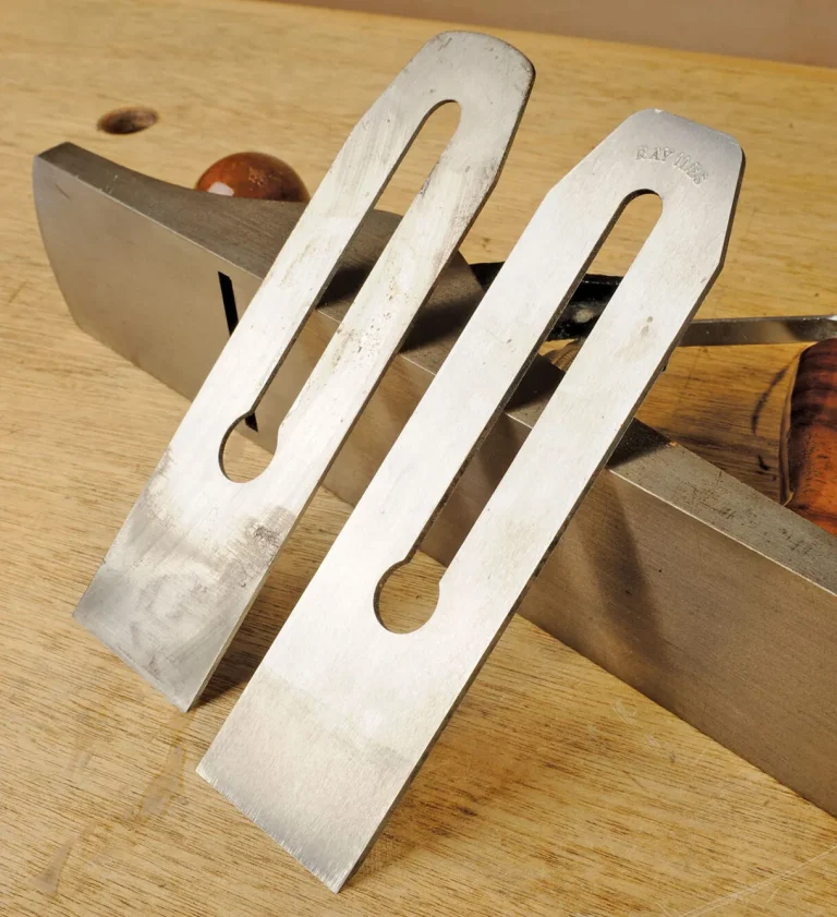 Hand plane blades on a wooden bench.