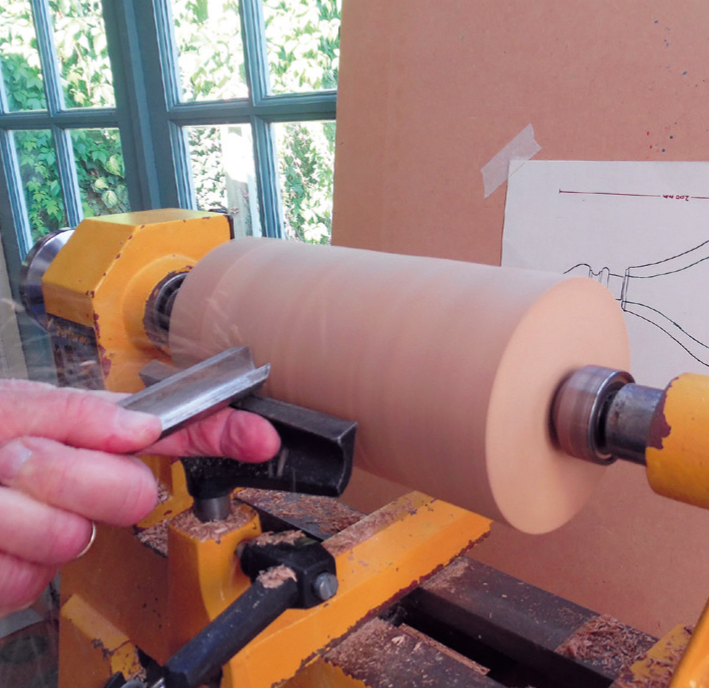 Woodturning process on a lathe machine.