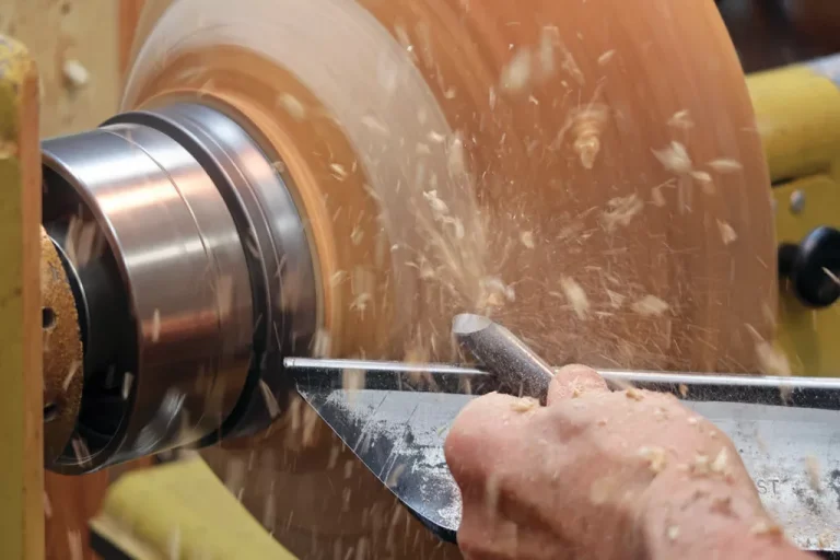 Woodturning on a lathe machine.