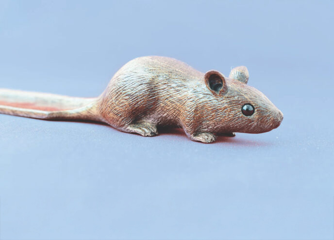 Brown mouse statue on a blue background