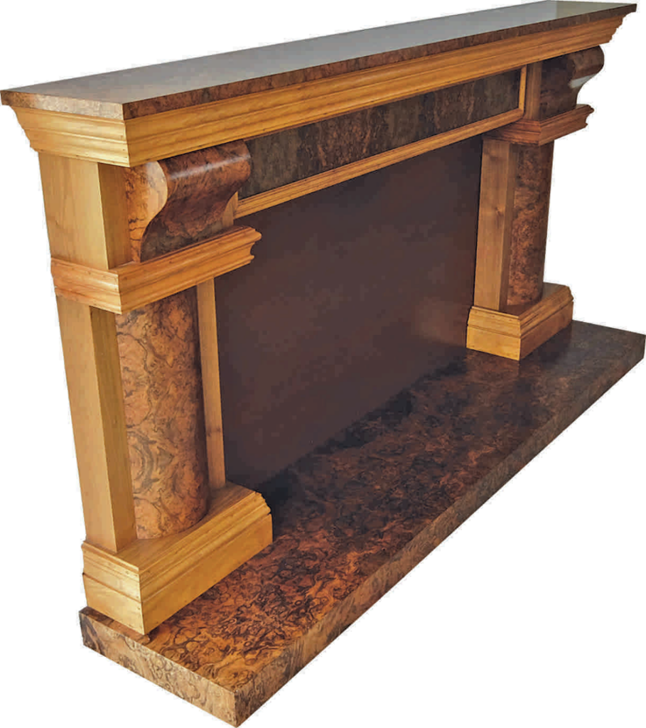 Ornate wooden mantelpiece with intricate detailing.