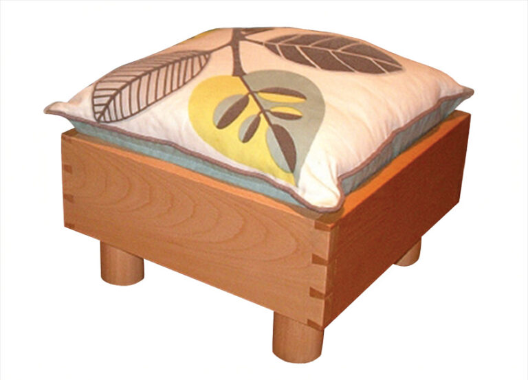 Wooden stool with leaf-patterned cushion