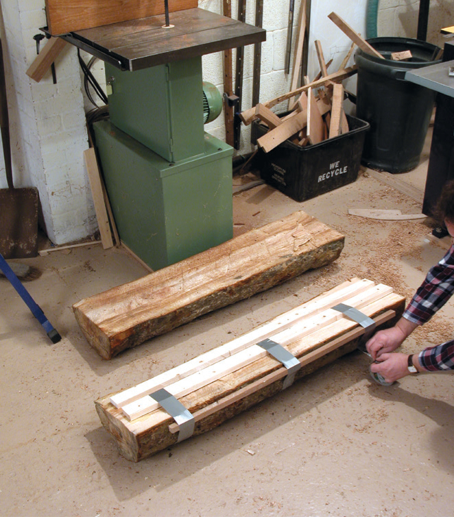 Preparing wooden logs for bandsaw milling.