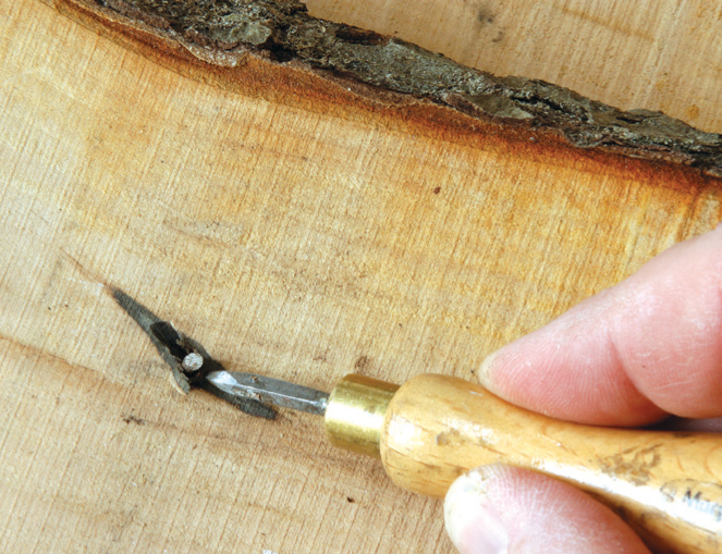 Hand carving wood with precision tool