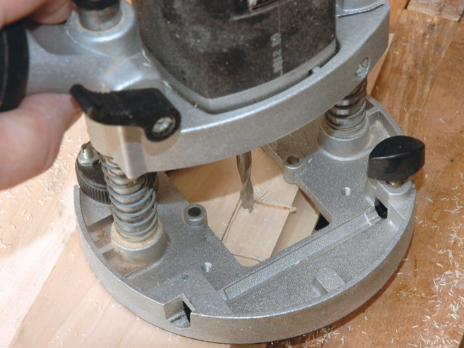 Close-up of electric wood router in use.