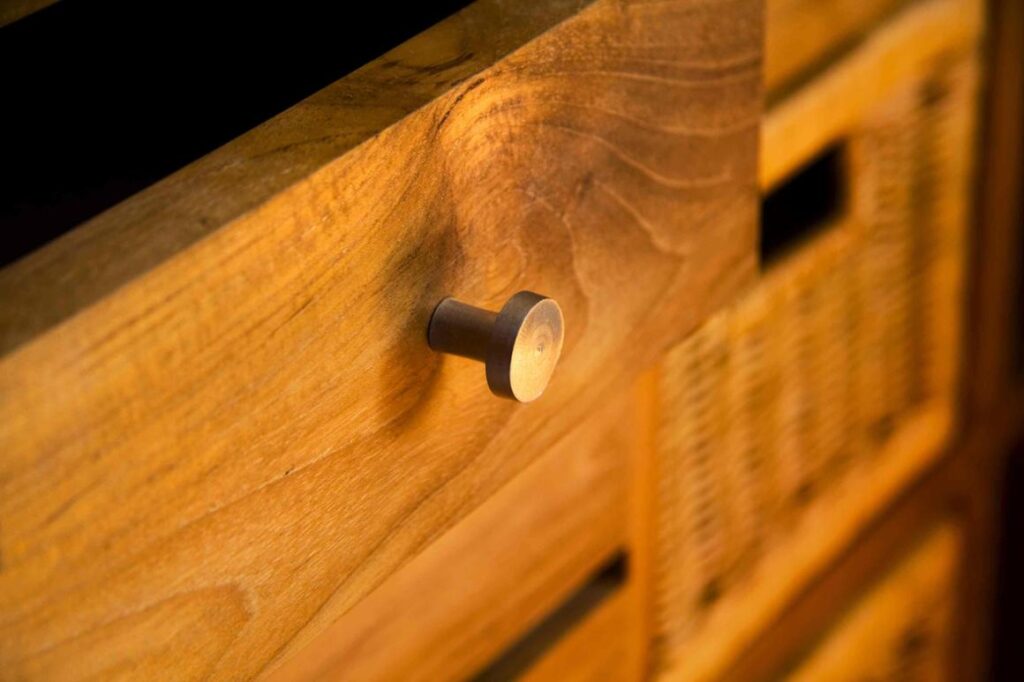 Wooden drawer with a round metal knob