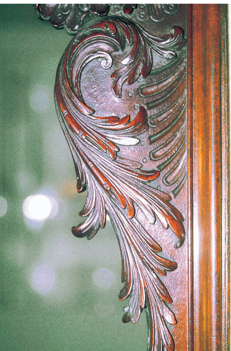 Intricate carved wooden furniture detail, Baroque style.
