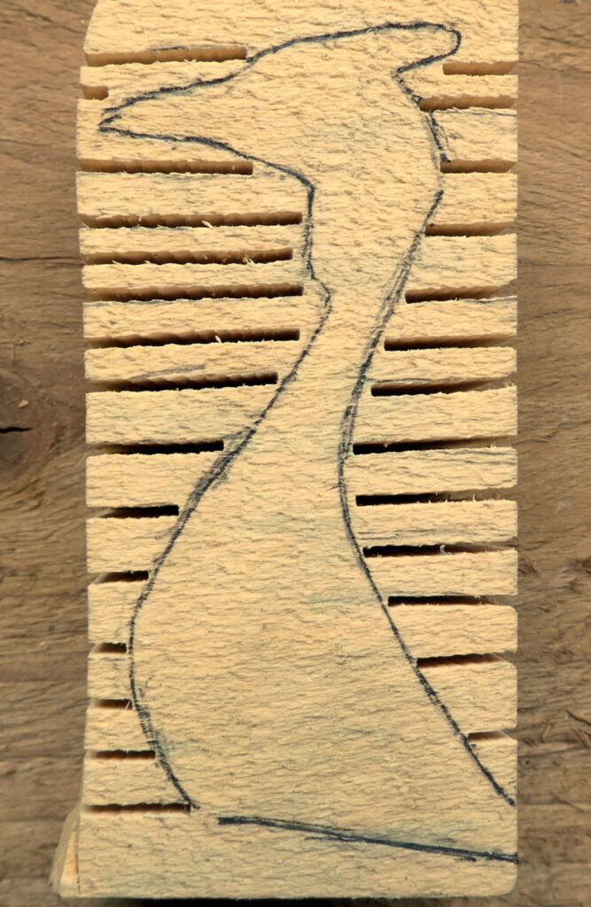 Wooden duck drawing on carved block