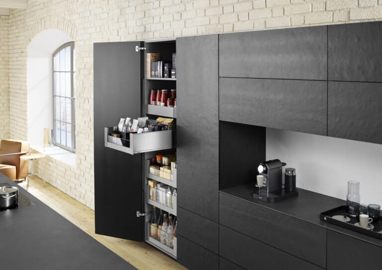 Modern kitchen with open pantry and coffee machine.