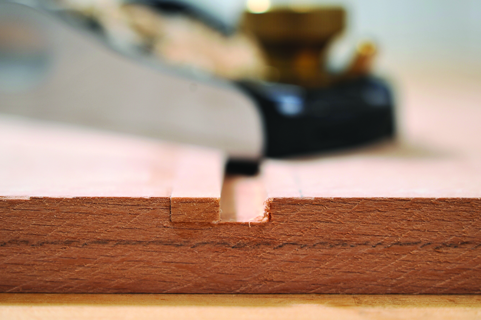 Close-up of precision wood planing tool.