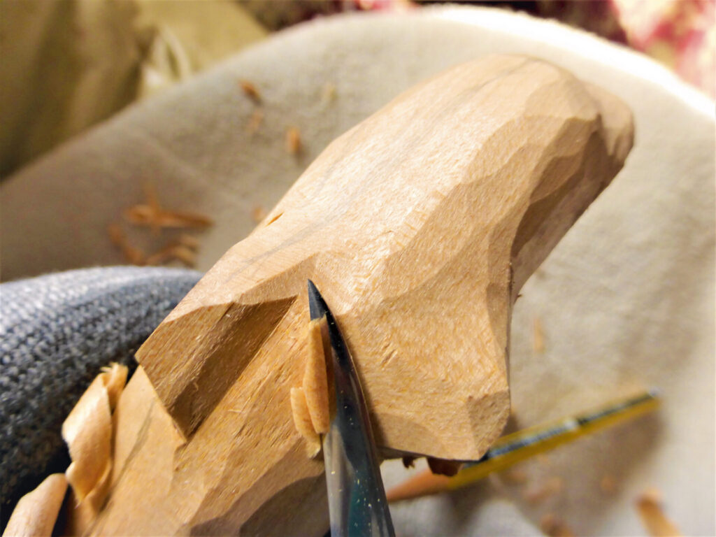 Close-up of wood carving in progress.