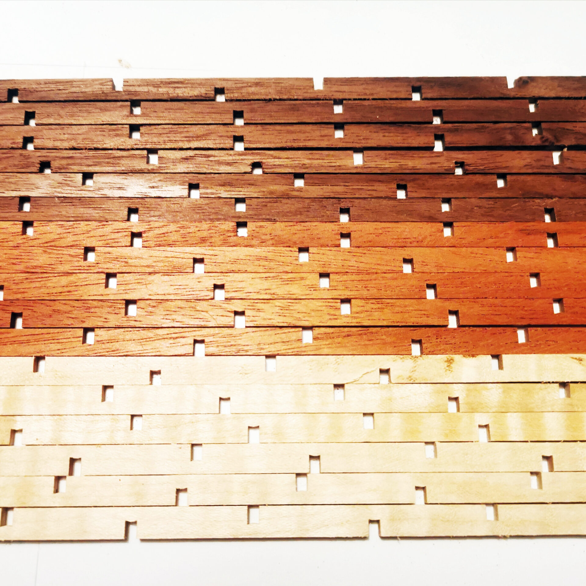 Wooden tiles pattern with varying shades.