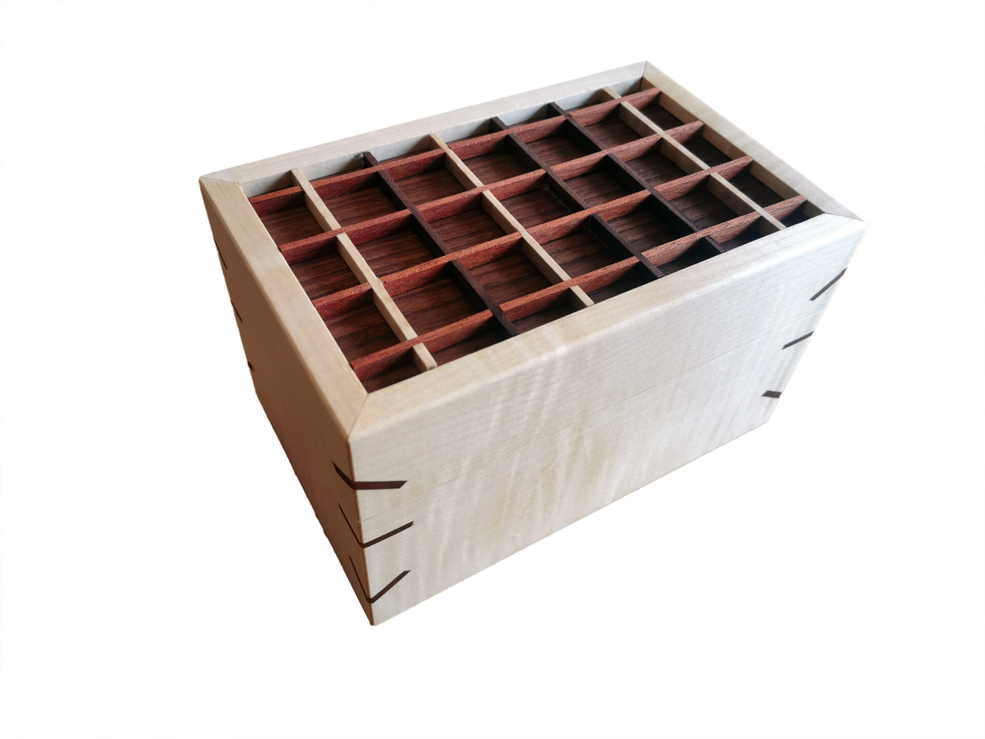 Wooden box with grid compartments, dovetail joints visible.