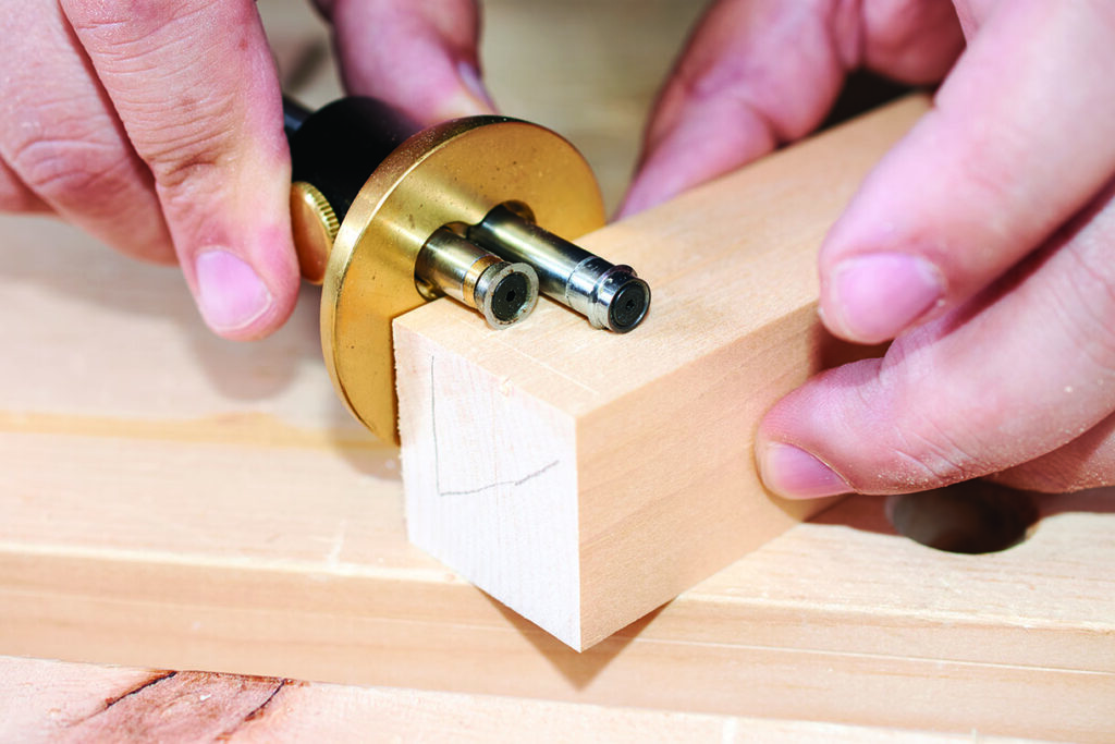 Using woodworking tool on wooden block