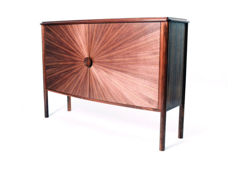 Elegant wooden cabinet with radiating pattern design.