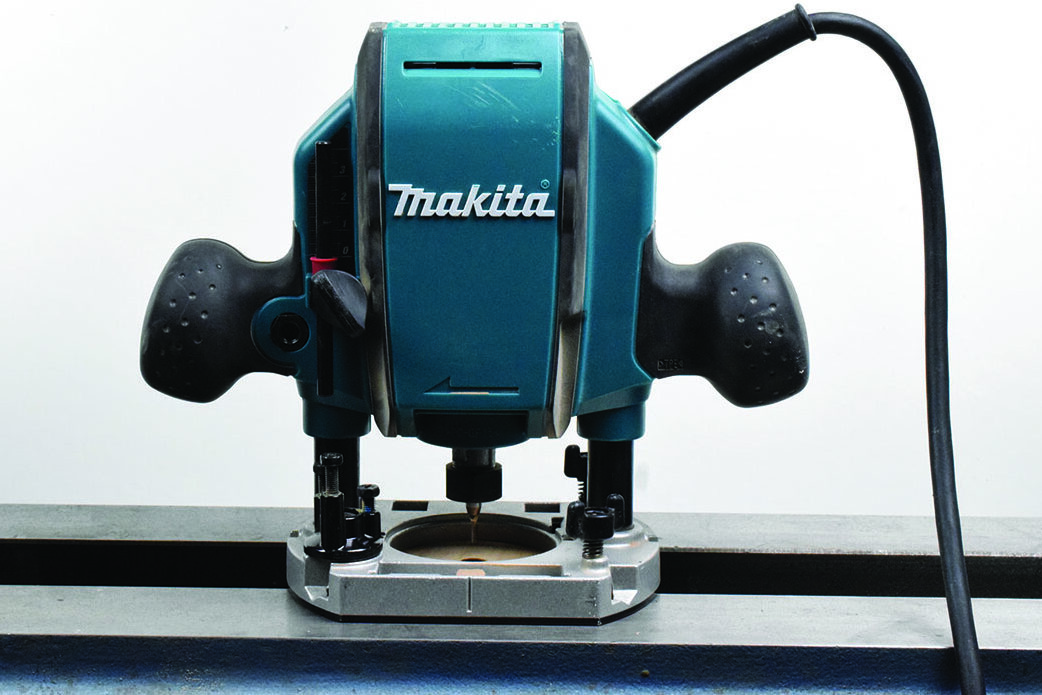 Makita woodworking router on table.