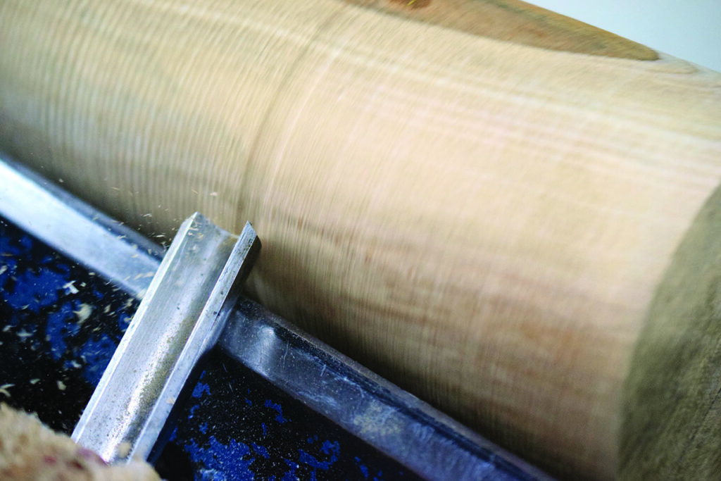 Woodturning tool carving spinning wooden piece