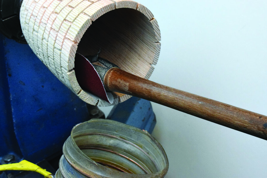 Woodturning lathe with sanding attachment tool