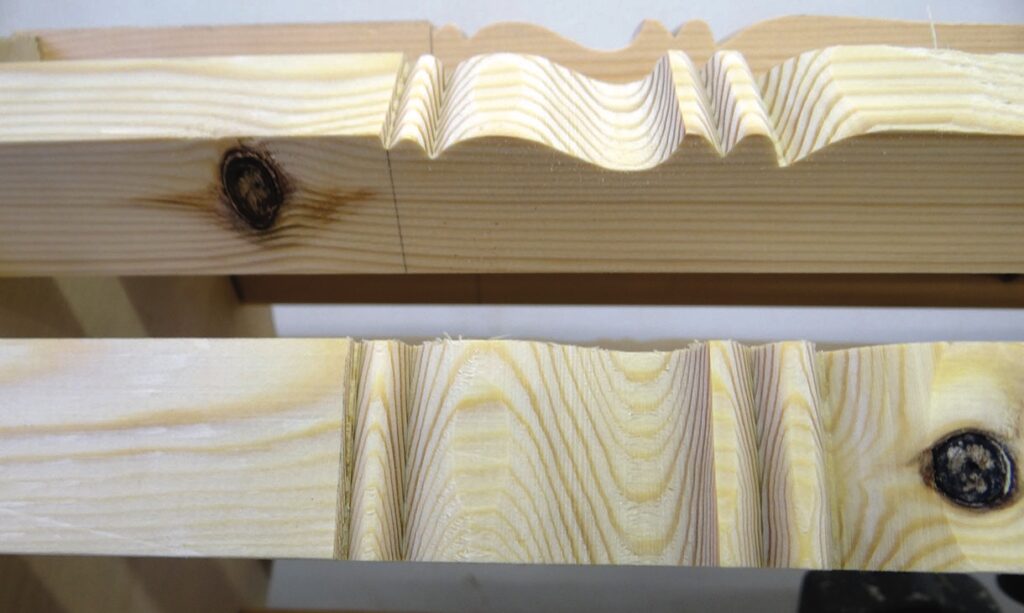 Close-up of carved wooden planks with knots