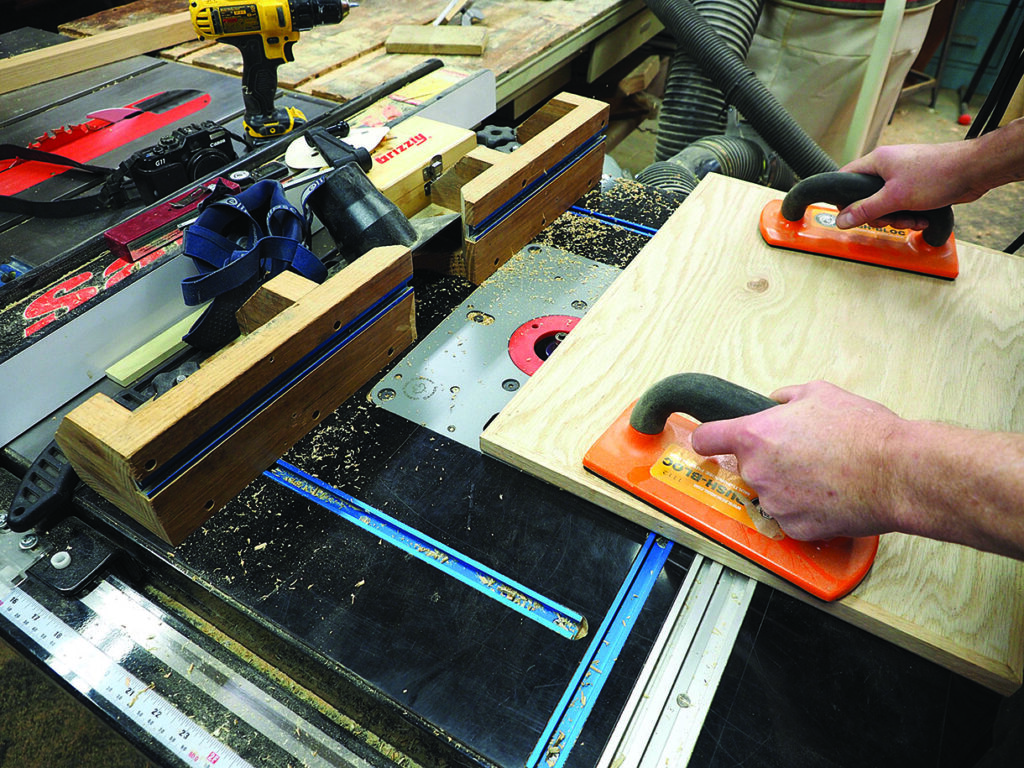 Woodworking with tools in a workshop setting.