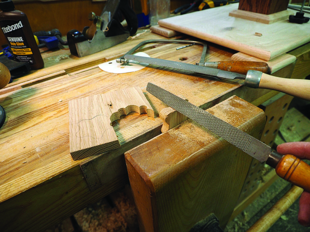 Filing wood on a workbench in a workshop.