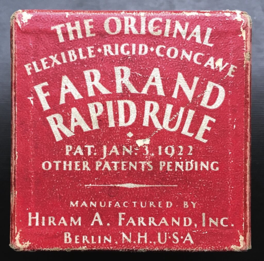 Red vintage Farrand measuring tape box from 1922.