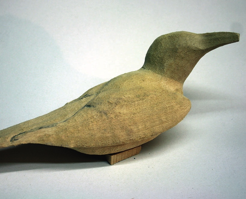 Wooden bird sculpture on display