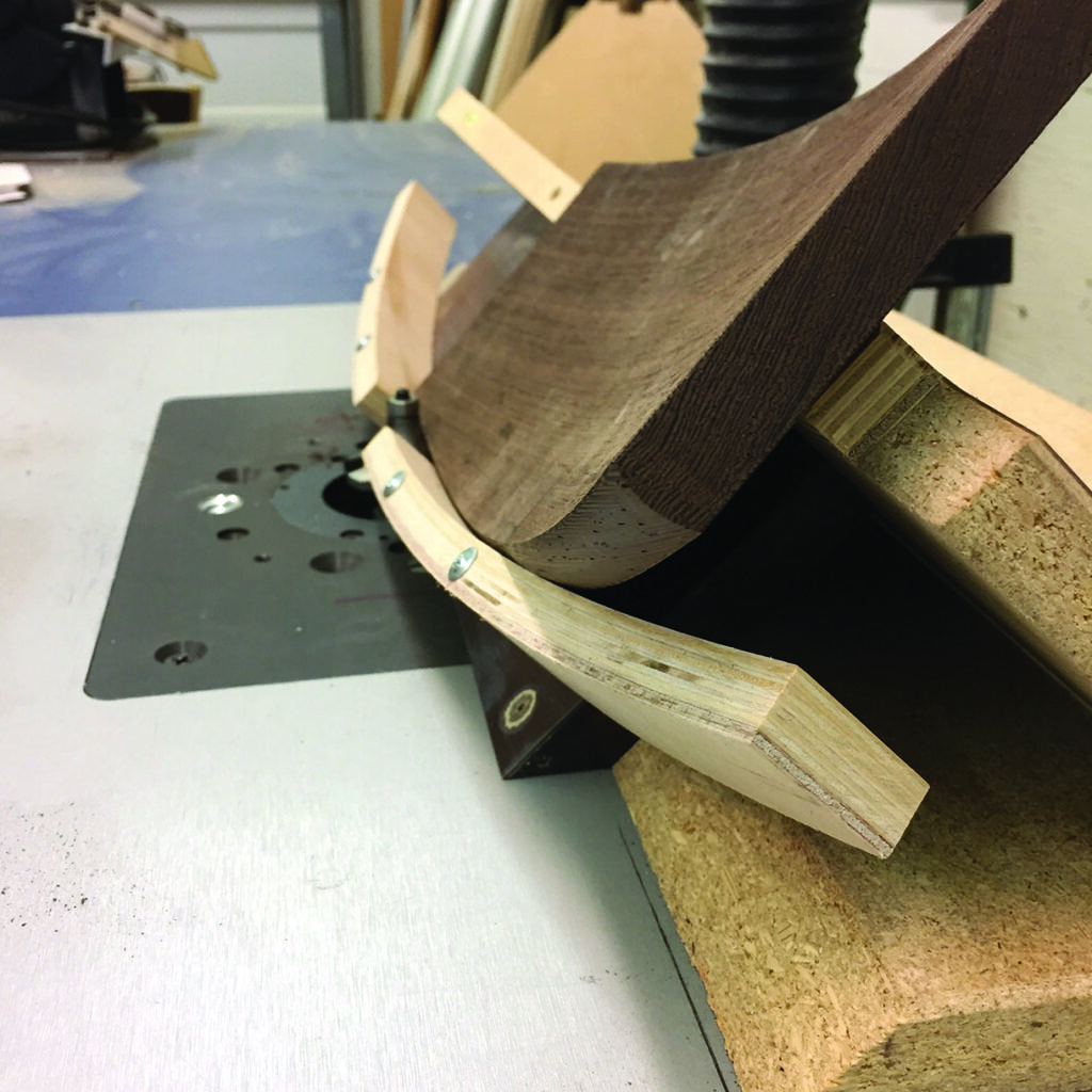 Wood being shaped with a CNC machine.