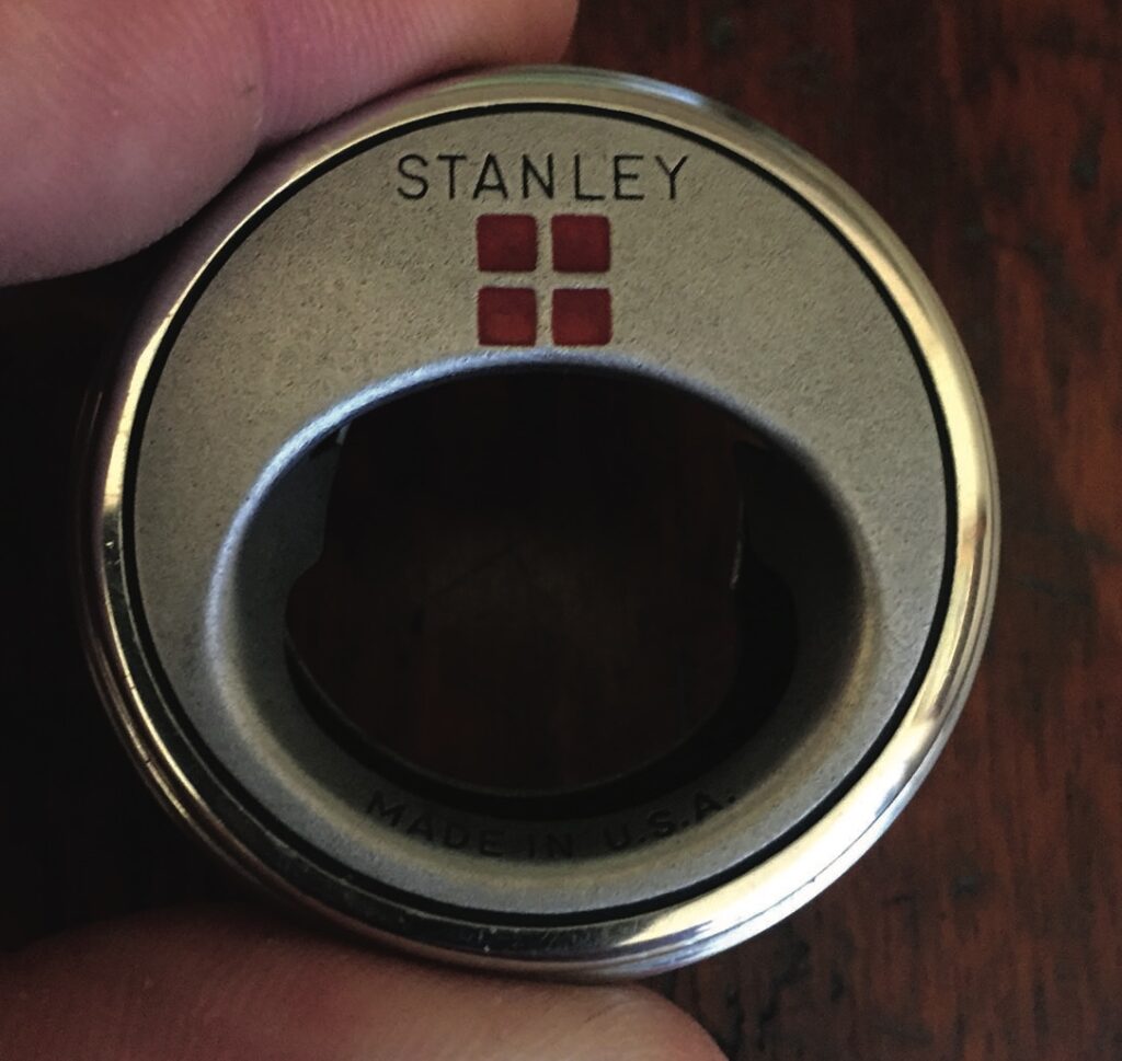 Stanley bottle opener, metallic with red logo.