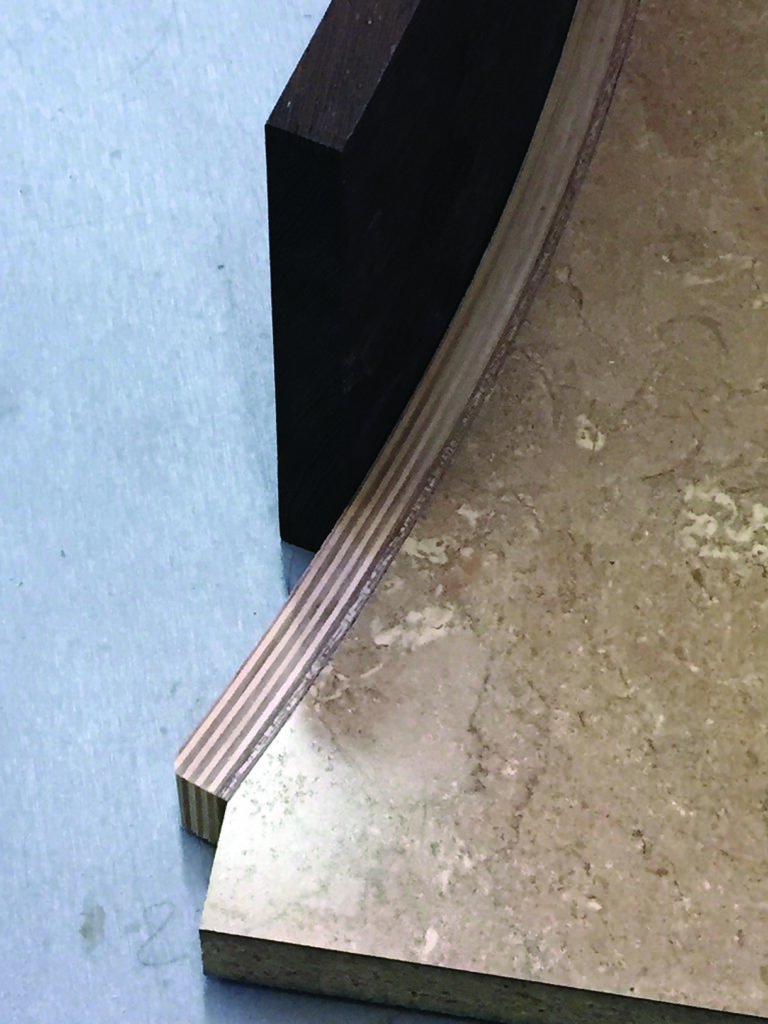 Curved marble slab with wooden edge