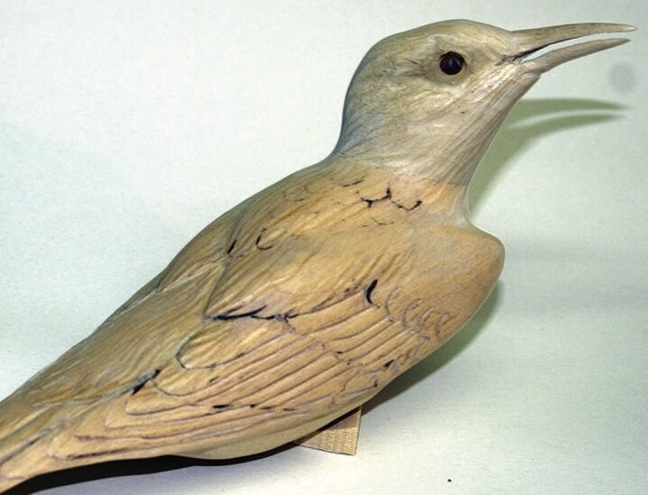 Wooden bird sculpture on display