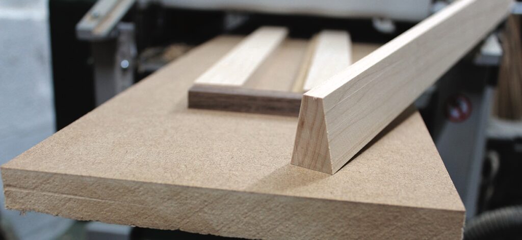 Wooden planks on a workshop table.