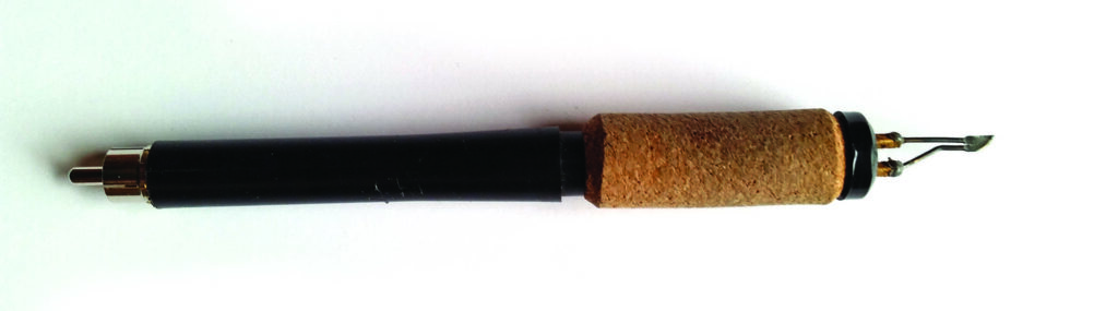 Pyrography pen with cork handle and tip.
