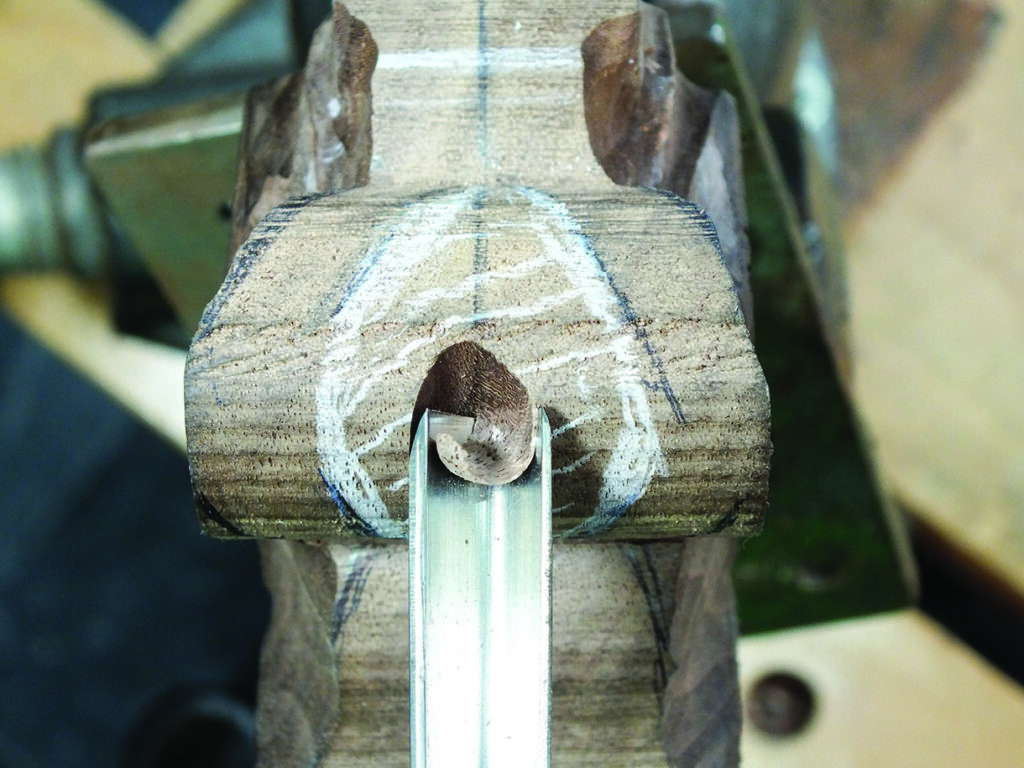 Wood carving with precise groove detail.