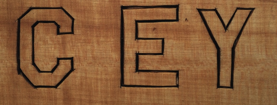 Wooden engraving of letters CEY