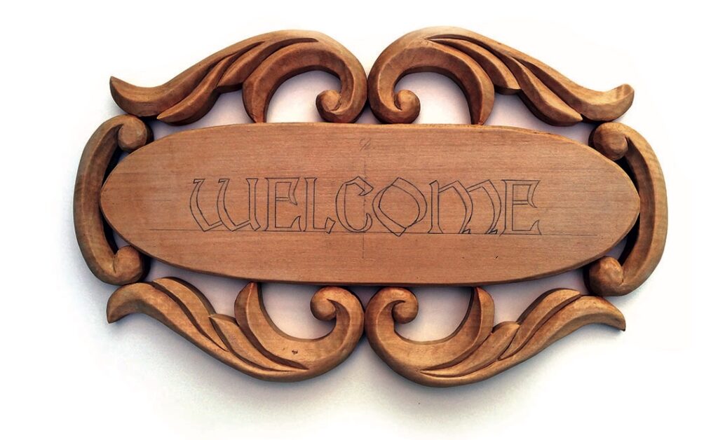 Wooden carved welcome sign with ornate design