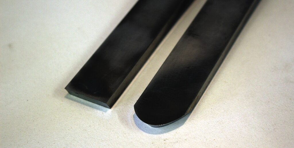 Two metal sticks on a table close-up.