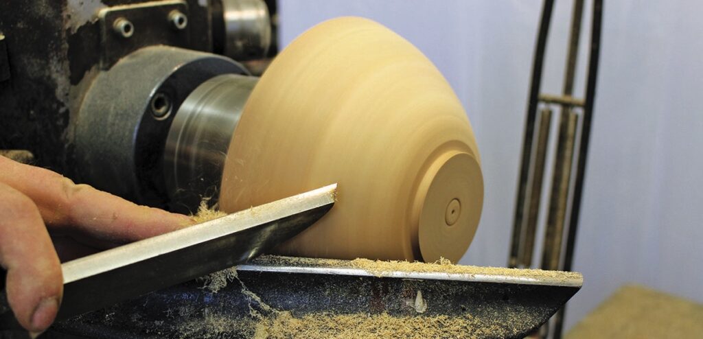 Woodturning a bowl on a lathe machine