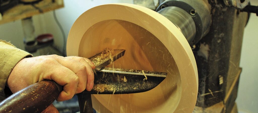 Woodturning a bowl on a lathe machine
