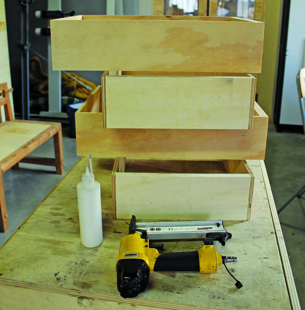 Wooden drawers with tools in workshop.