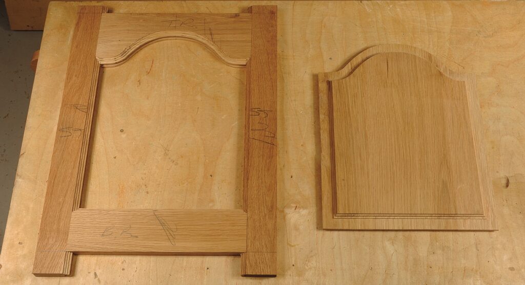 Wooden cabinet door parts on workbench