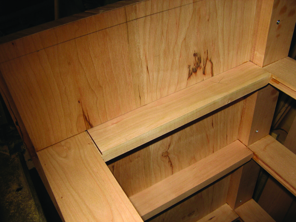 Close-up of unfinished wooden staircase.