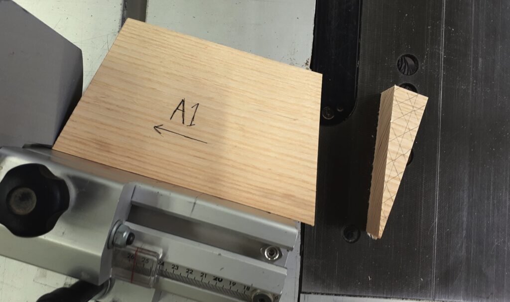 Wood pieces marked A1 on saw table